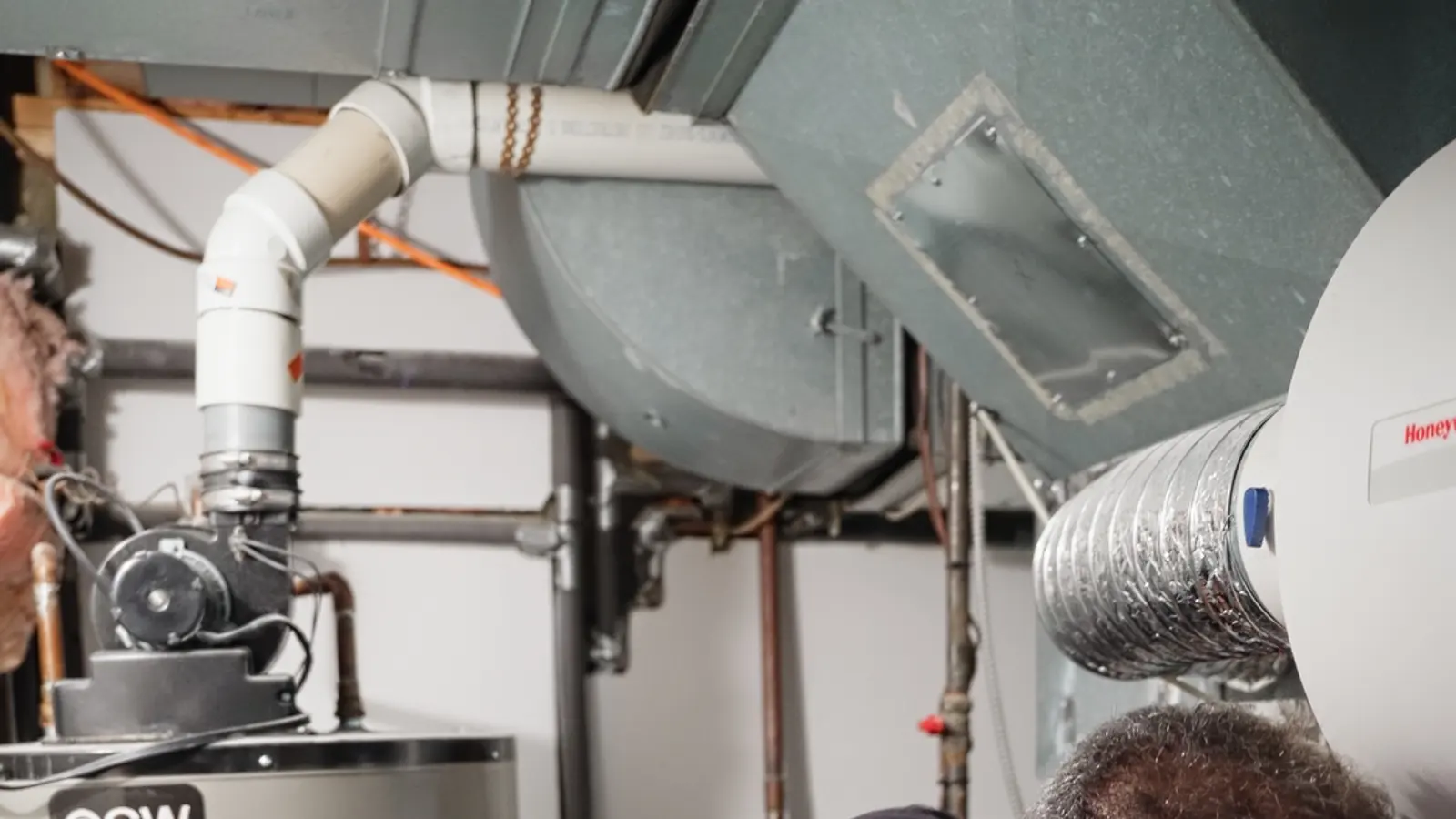 H&C technician working on a tank water heater