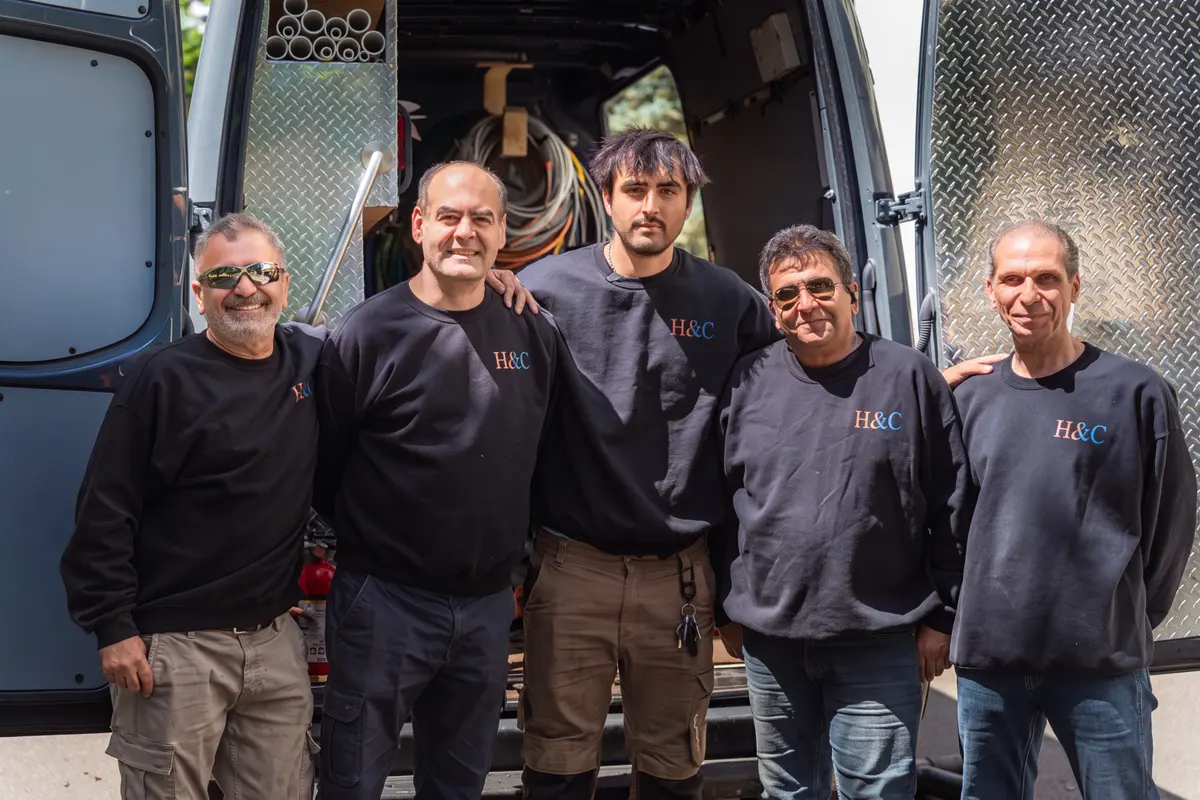 H&C crew members by the service van
