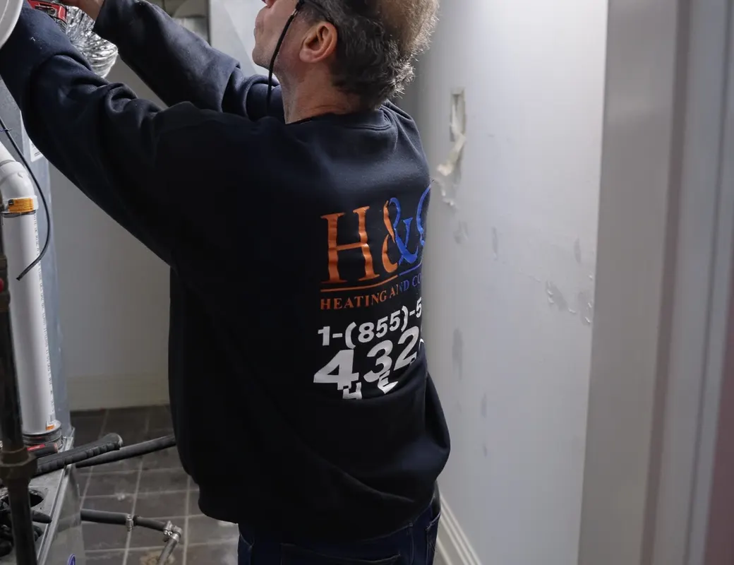 H&C technician working on boiler piping