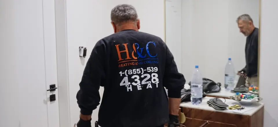 H&C technician performing an in-home heating assessment